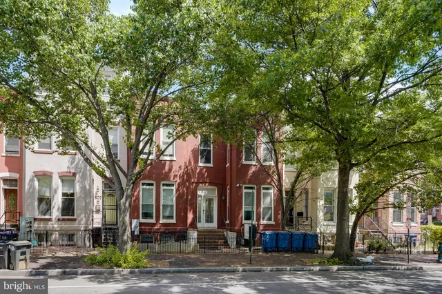 a kitchen with stainless steel appliances granite countertop a refrigerator sink and stove