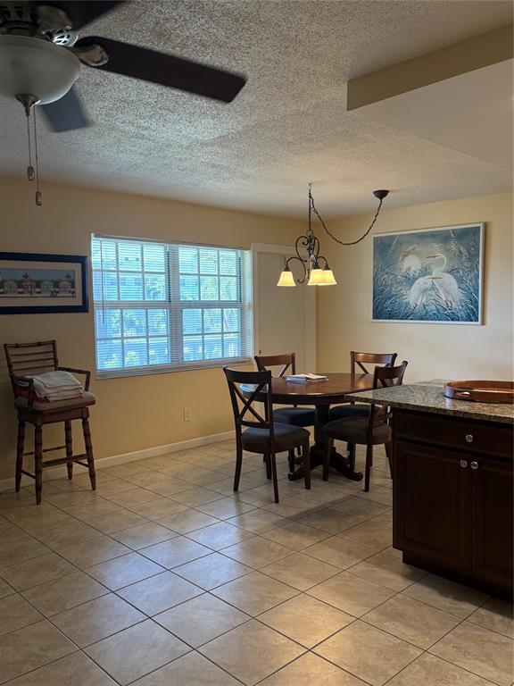 2455 Northeast 51st Street, Unit 207 Fort Lauderdale, FL 33308 - Photo 2 of 6 a view of a dining room with furniture window and wooden floor