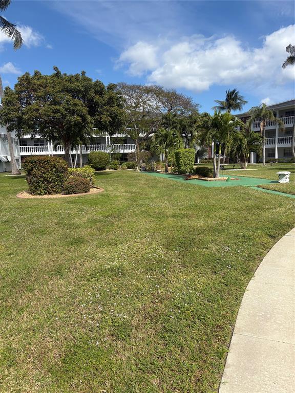 2455 Northeast 51st Street, Unit 207 Fort Lauderdale, FL 33308 - Photo 6 of 6 a view of a garden