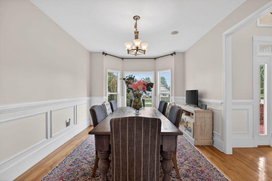 15 Fast Lane Ranburne, AL 36273 - Photo 29 of 51 a view of a dining room with furniture a chandelier and wooden floor