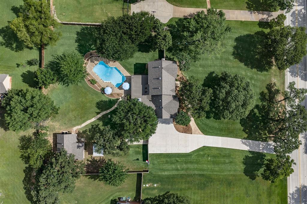 410 Simmons Road Double Oak, TX 75077 - Photo 37 of 40 Aerial view capturing the pool, patio, and perfect yard.