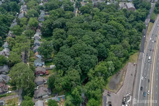 a view of a street with a yard