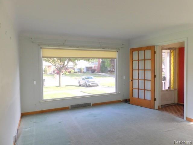 14841 Champaign Road Allen Park, MI 48101 - Photo 10 of 41 10. SPACIOUS LIVING ROOM FEATURES COVE CEILINGS + HARDWOOD FLOORS UNDER CARPET!