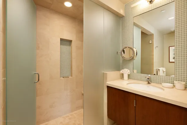 a bathroom with a double vanity sink and a mirror