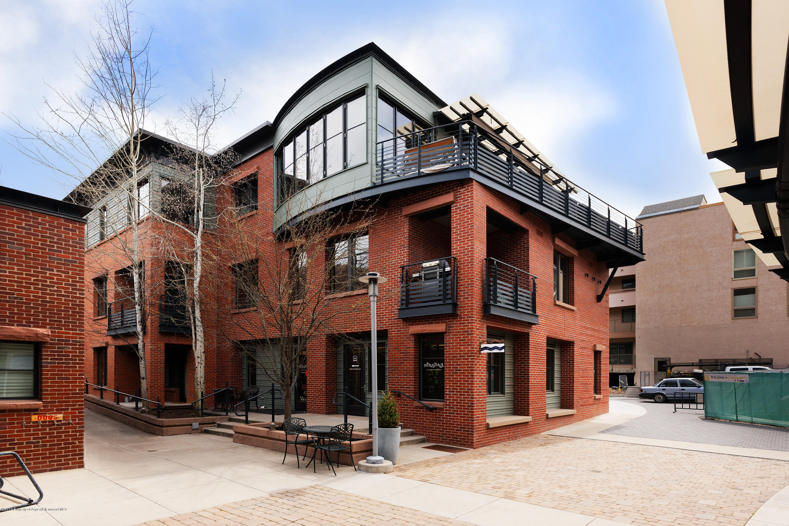 102 Founders Place, Unit 301 Aspen, CO 81611 - Photo 26 of 28 a view of a building with a large windows
