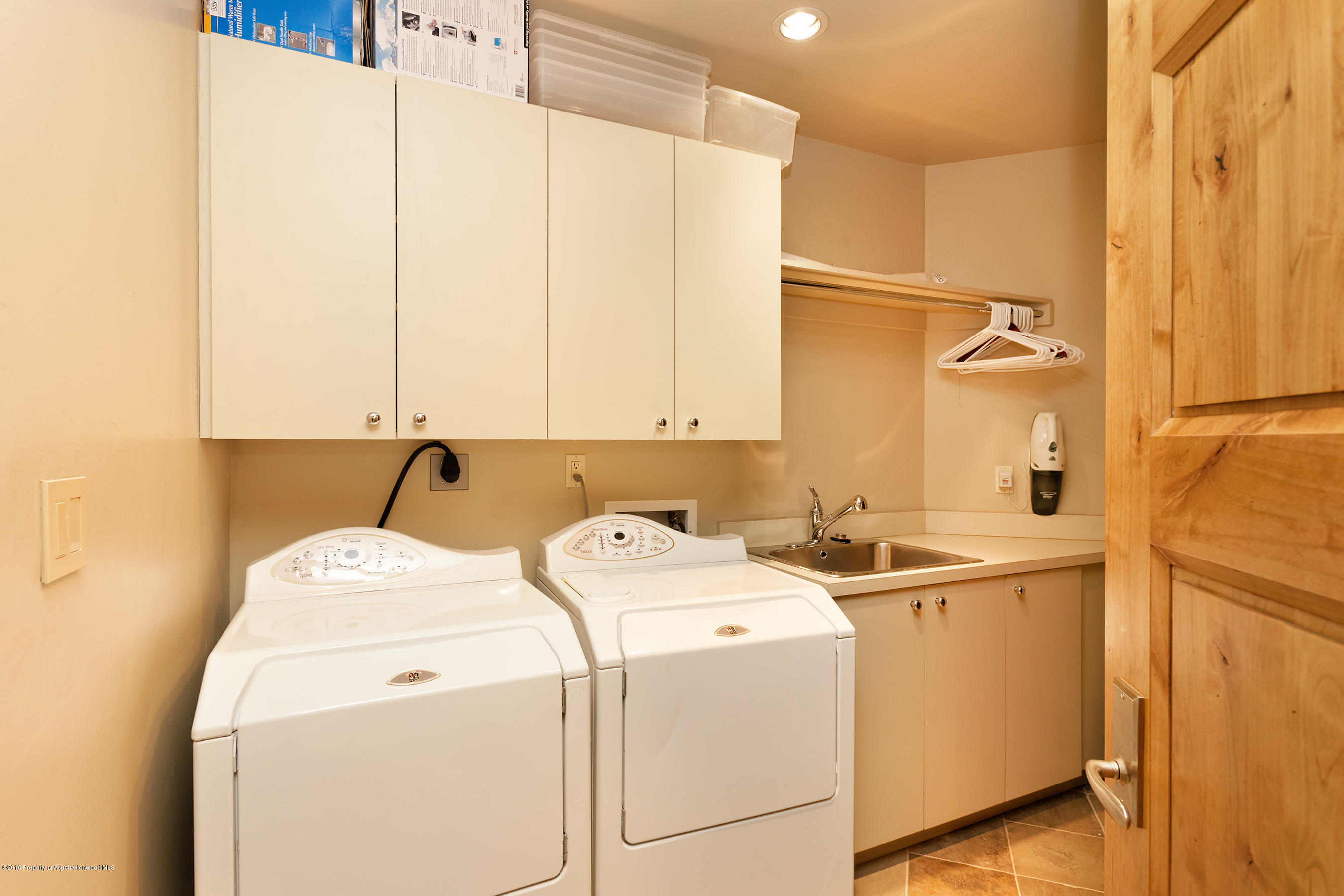 102 Founders Place, Unit 301 Aspen, CO 81611 - Photo 27 of 28 a utility room with dryer and washer
