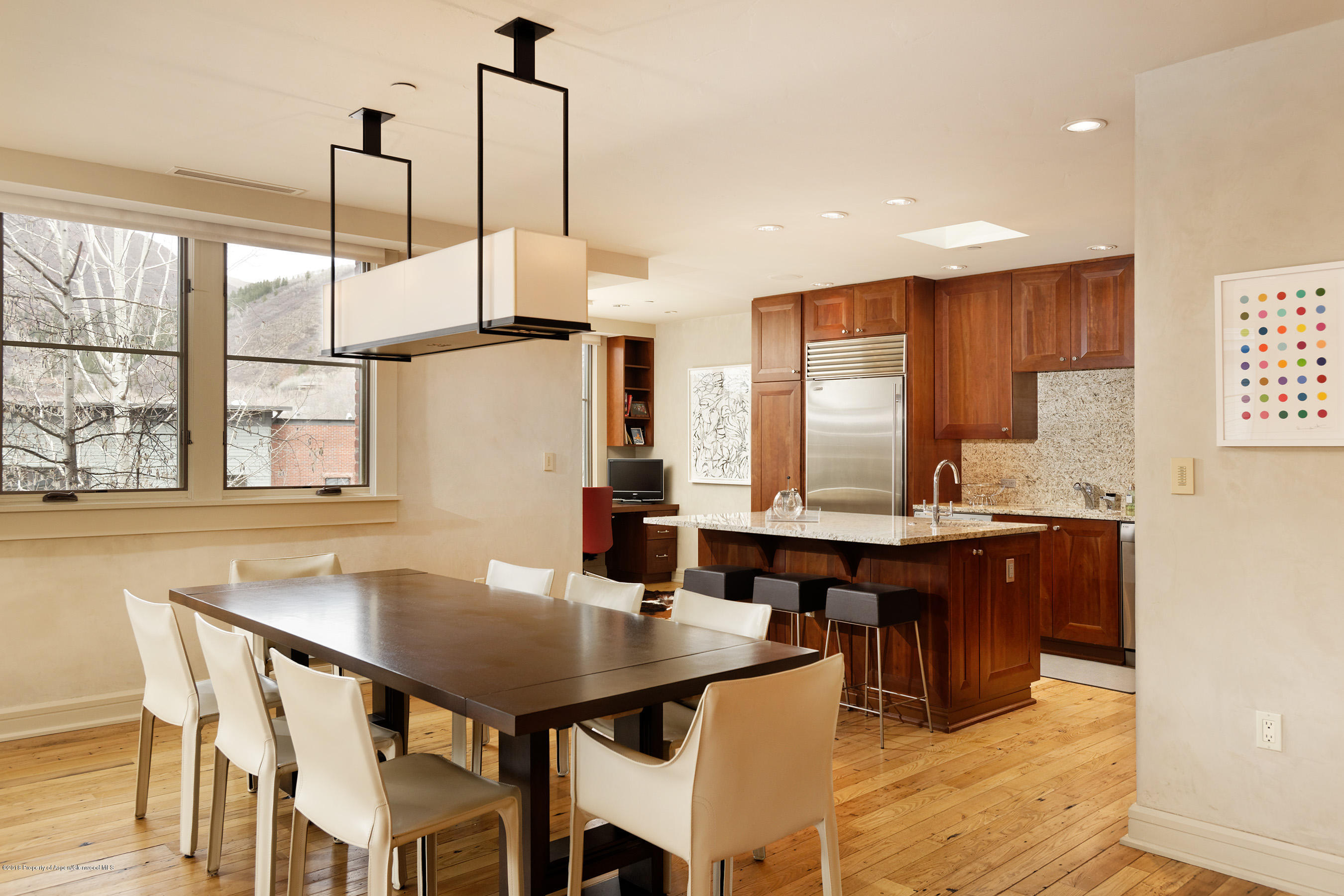 102 Founders Place, Unit 301 Aspen, CO 81611 - Photo 6 of 28 a view of a dining room with furniture