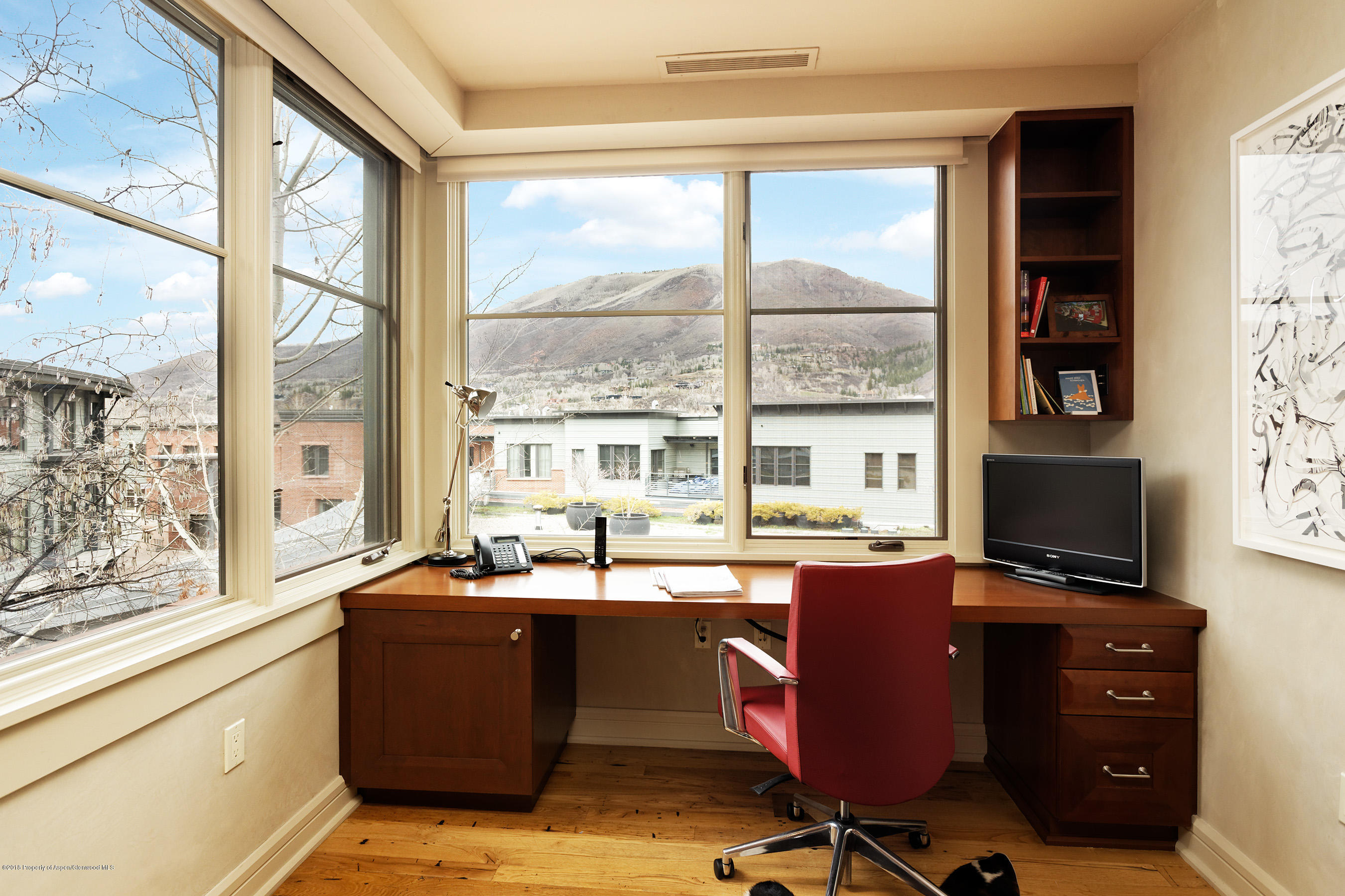 102 Founders Place, Unit 301 Aspen, CO 81611 - Photo 10 of 28 a view of a workspace with furniture and a window