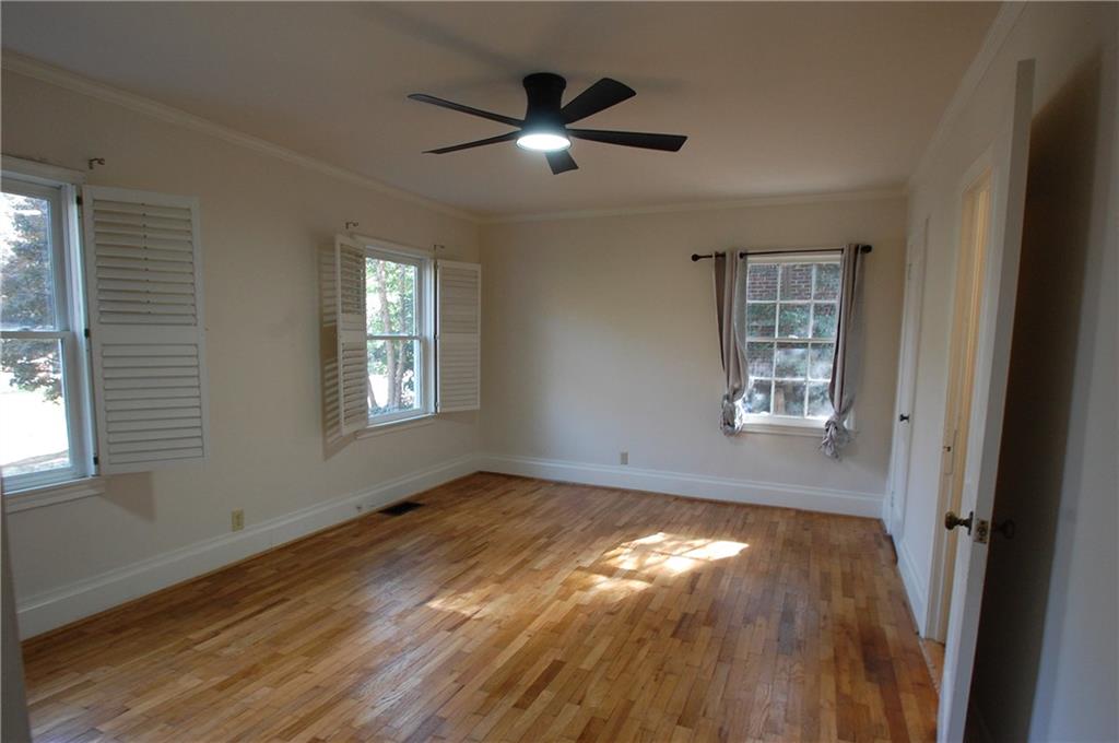 3347 College Street Atlanta, GA 30337 - Photo 18 of 39 a view of empty room with wooden floor and fan