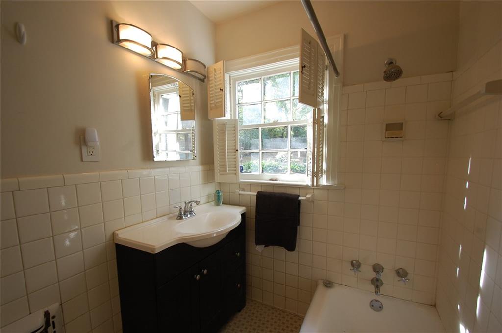 3347 College Street Atlanta, GA 30337 - Photo 25 of 39 a bathroom with a sink and a mirror