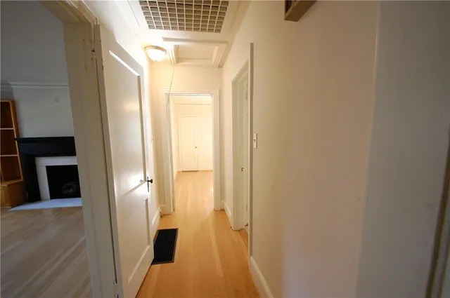 a view of a bathroom from a hallway