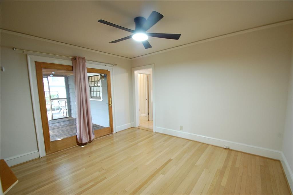 3347 College Street Atlanta, GA 30337 - Photo 27 of 39 wooden floor in an empty room with a window