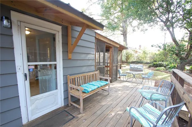 a view of balcony with two chairs and a table