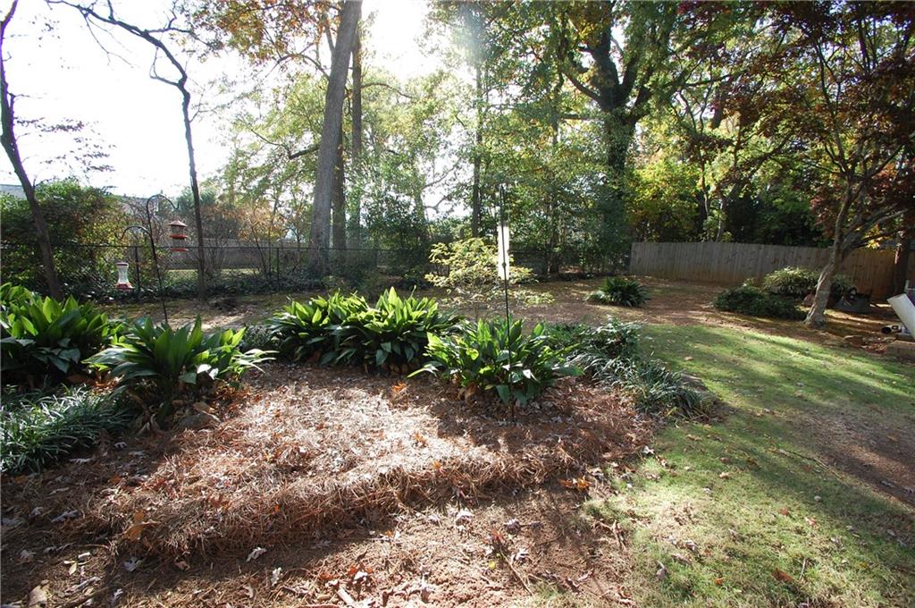 3347 College Street Atlanta, GA 30337 - Photo 37 of 39 a backyard of a house with lots of green space