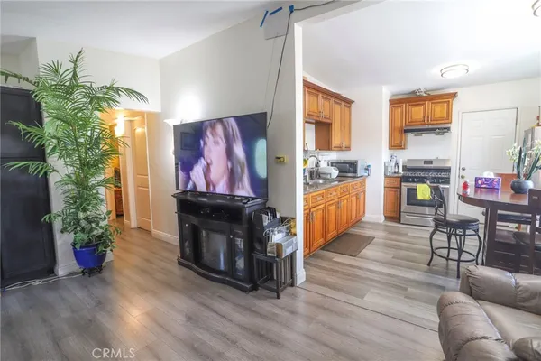a view of a dining room with furniture and wooden floor