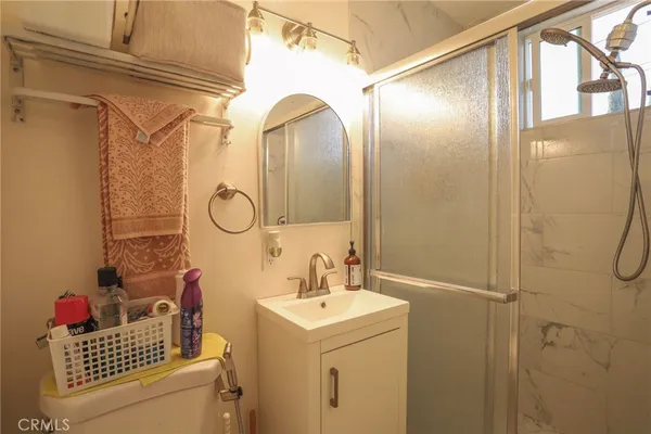 a bathroom with a sink a vanity and a mirror