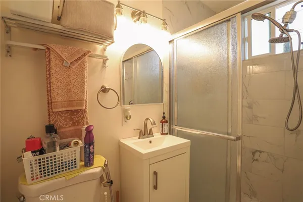 a bathroom with a sink a vanity and a mirror
