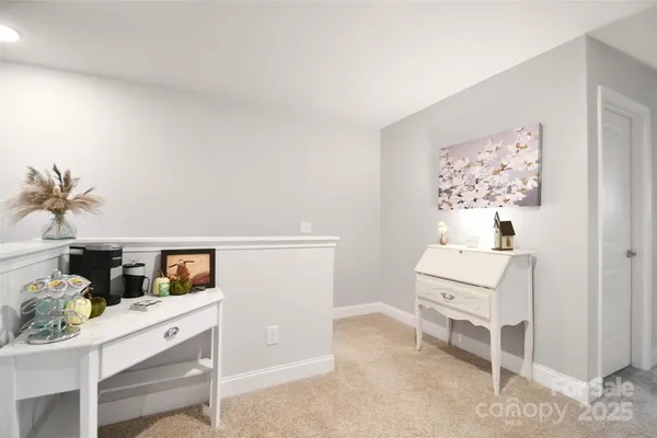 a room that has a dresser and a chair in it
