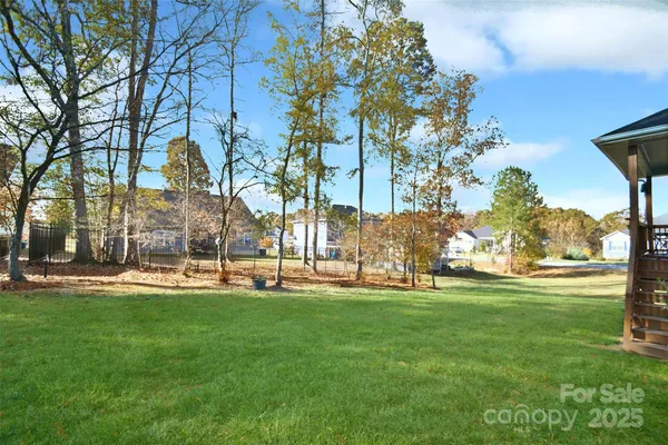 a backyard of apartments with large trees