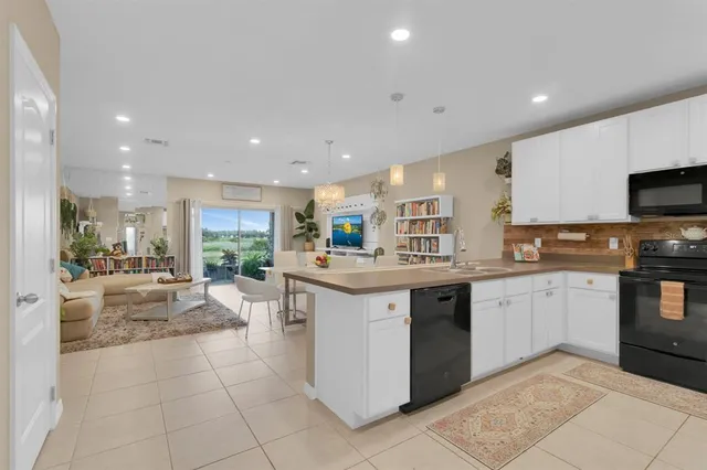 a kitchen with a refrigerator and a sink