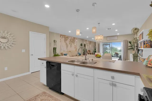a kitchen with stainless steel appliances granite countertop a sink and a stove