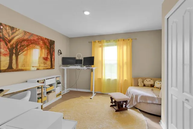 a bathroom with double vanity sink a mirror and a shower