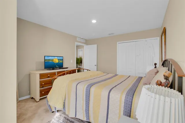 a view of a livingroom with furniture and a flat screen tv