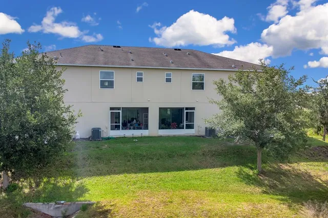 a view of a backyard with plants and a garden