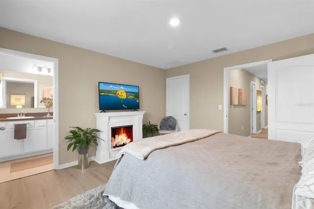 a bathroom with a double vanity sink mirror and toilet