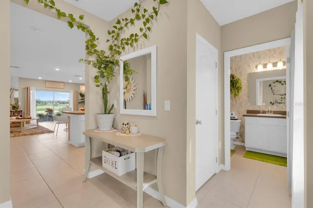 a spacious bathroom with a double vanity sink and a mirror