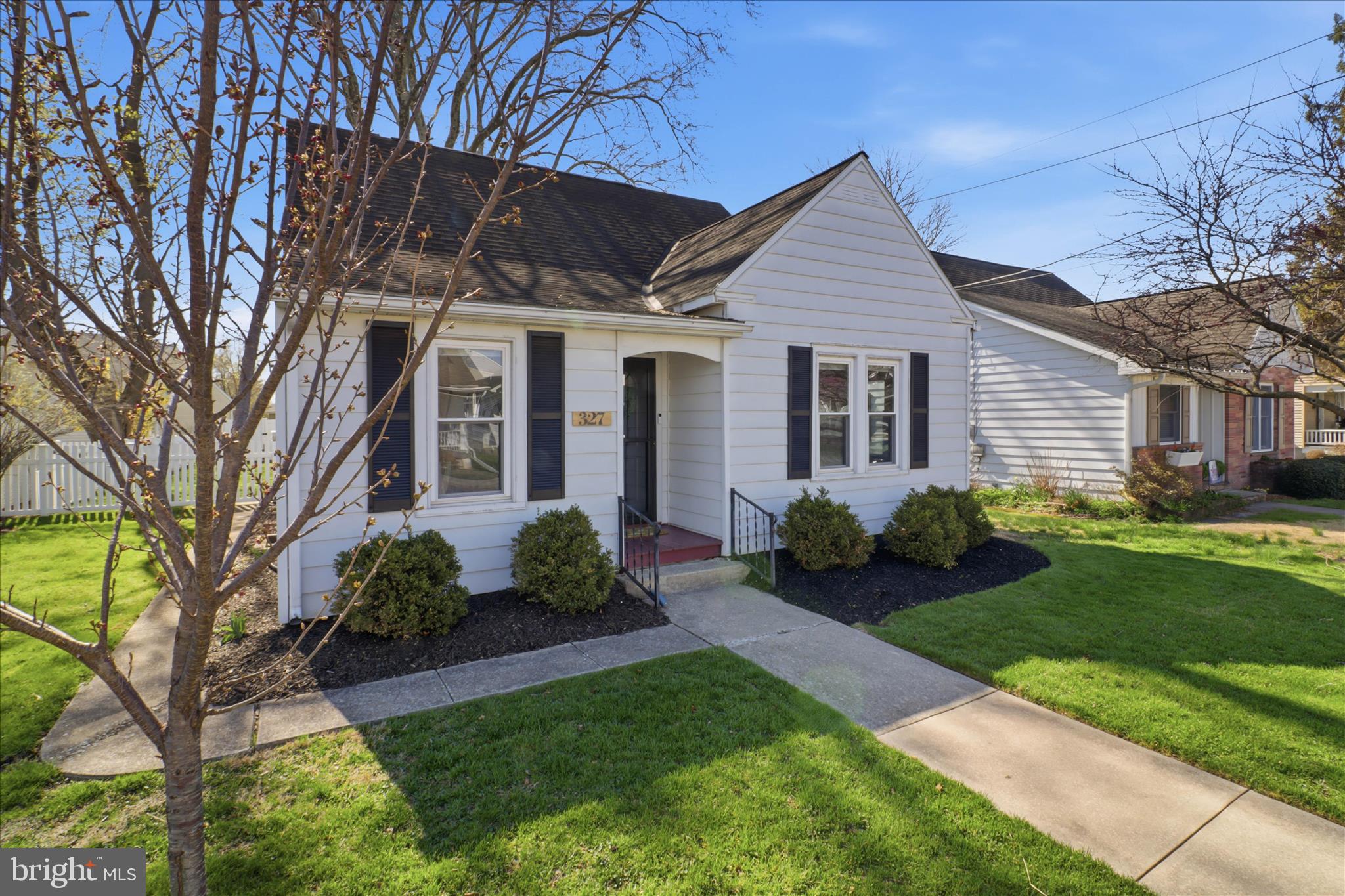 327 Dover Street Manheim, PA 17545 - Photo 1 of 43 a front view of a house with garden