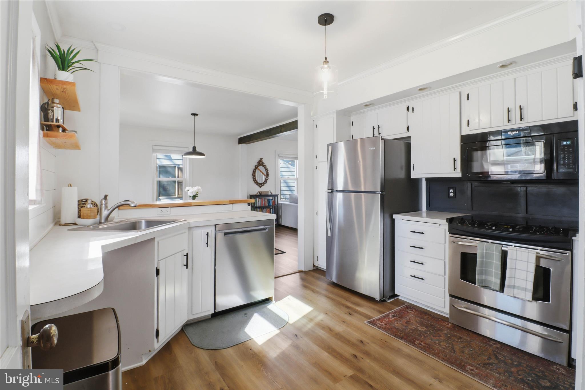 327 Dover Street Manheim, PA 17545 - Photo 14 of 43 a kitchen with stainless steel appliances a stove a refrigerator and a sink