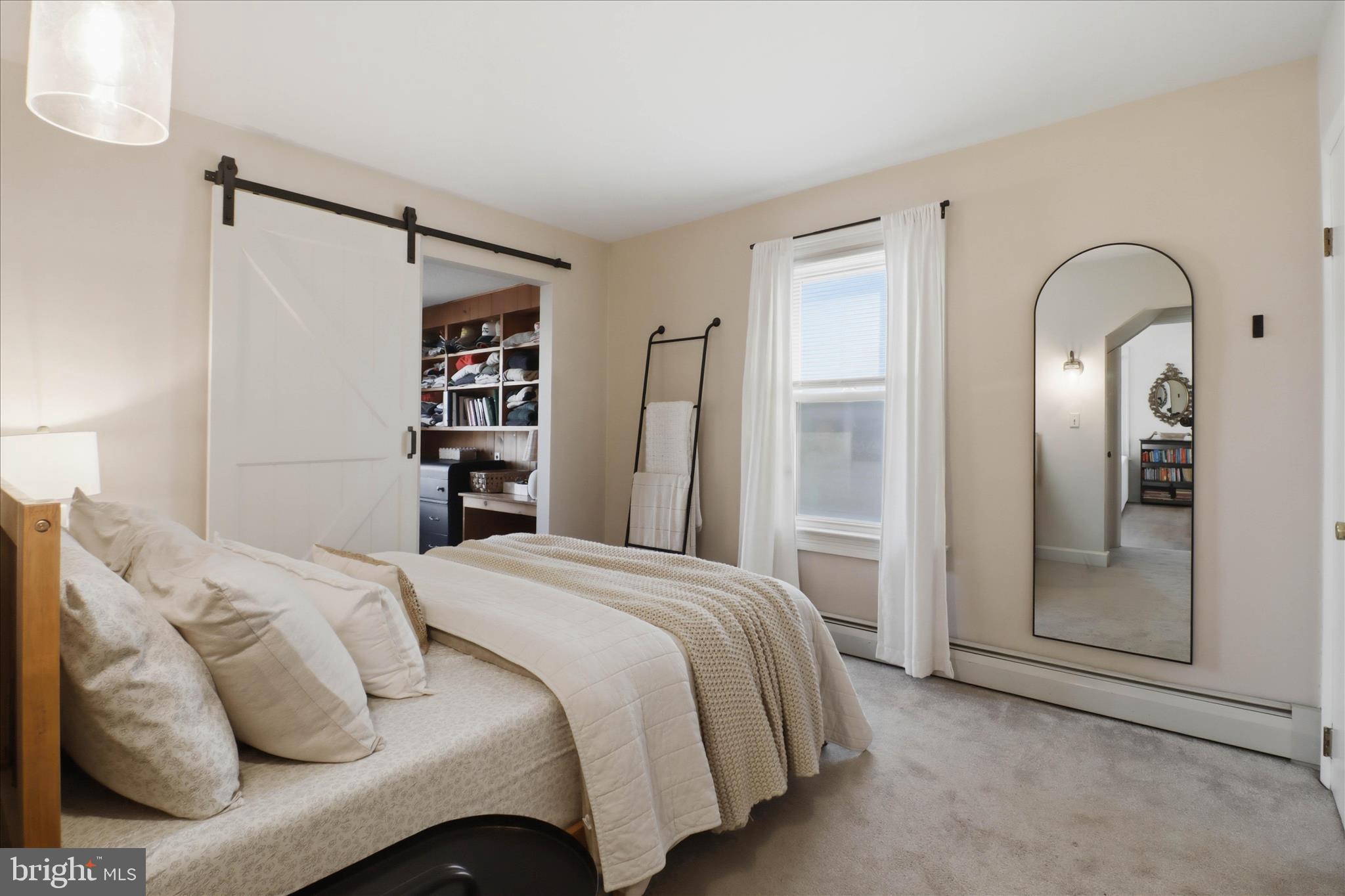327 Dover Street Manheim, PA 17545 - Photo 19 of 43 a bedroom with a bed and a mirror