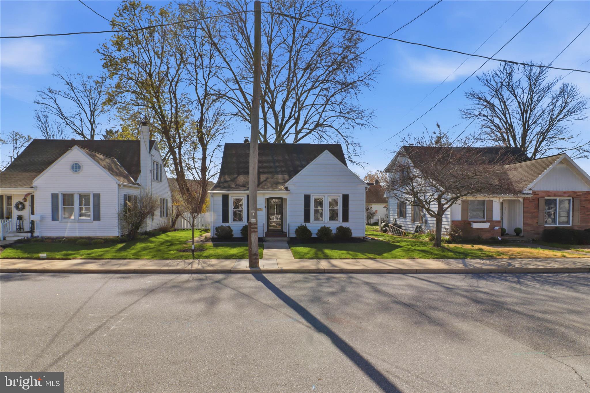 327 Dover Street Manheim, PA 17545 - Photo 2 of 43 a front view of a house with a yard and porch