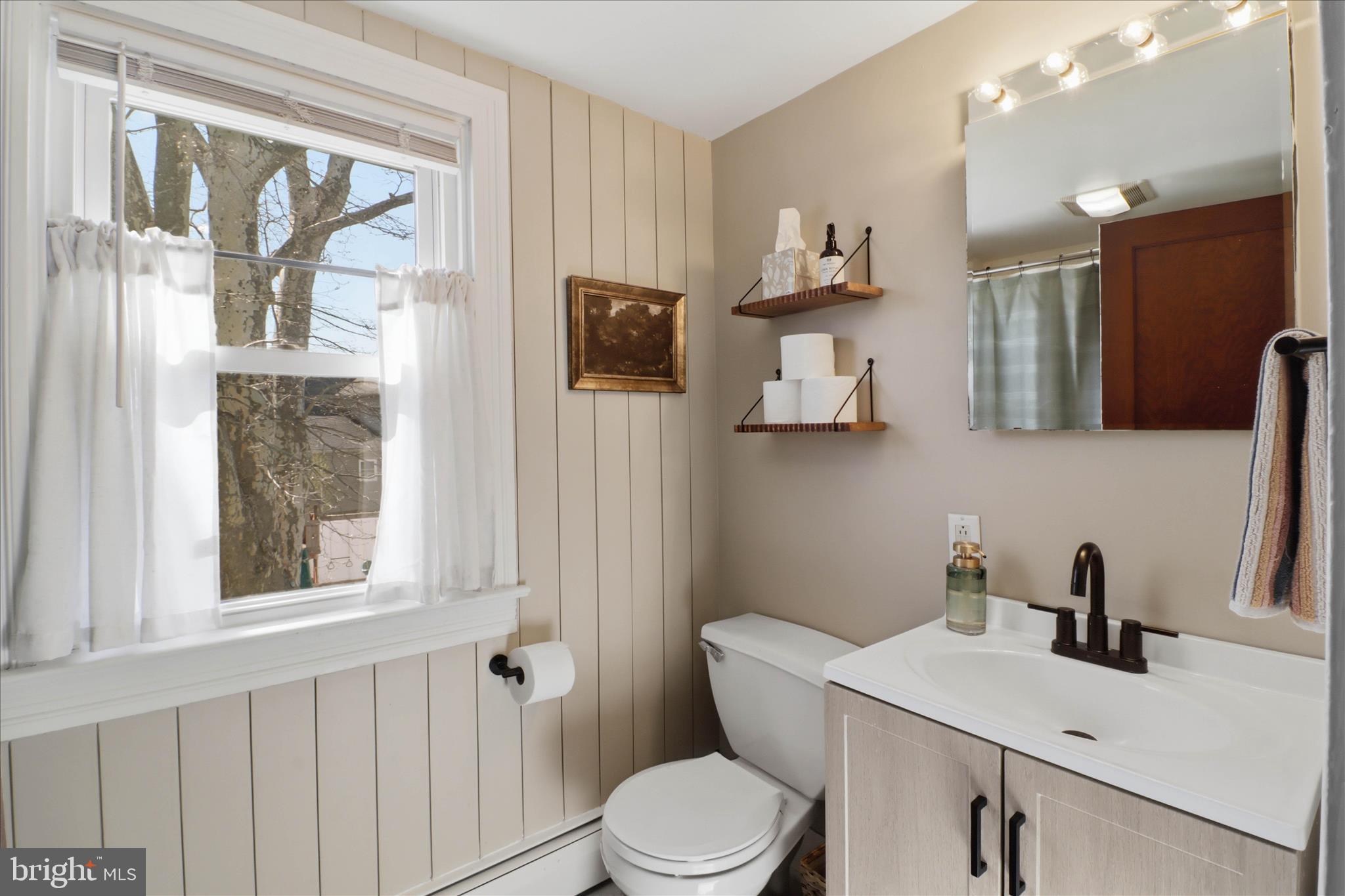 327 Dover Street Manheim, PA 17545 - Photo 30 of 43 a bathroom with a sink vanity mirror and toilet