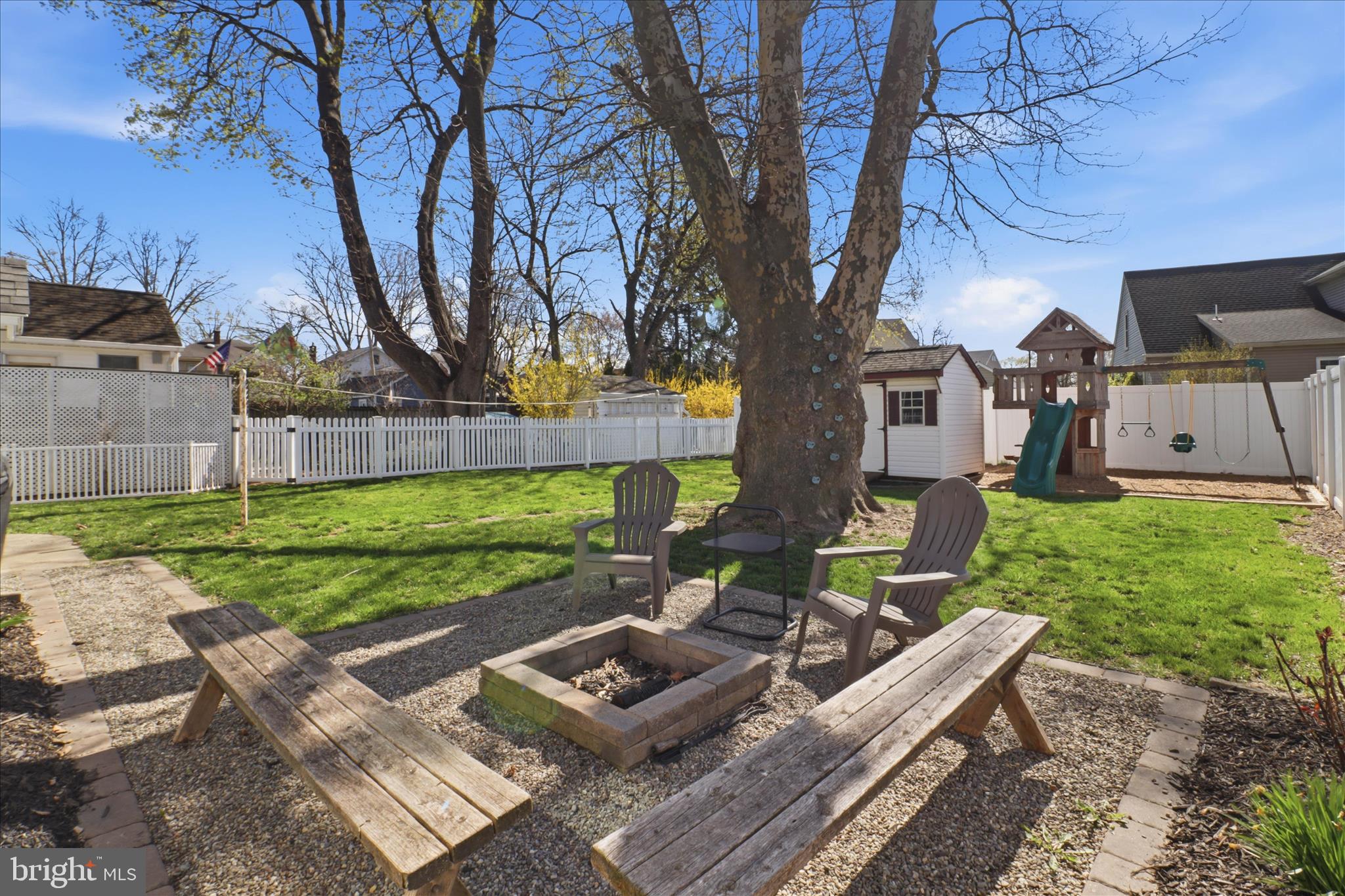 327 Dover Street Manheim, PA 17545 - Photo 34 of 43 a view of a backyard with table and chairs potted plants and large tree