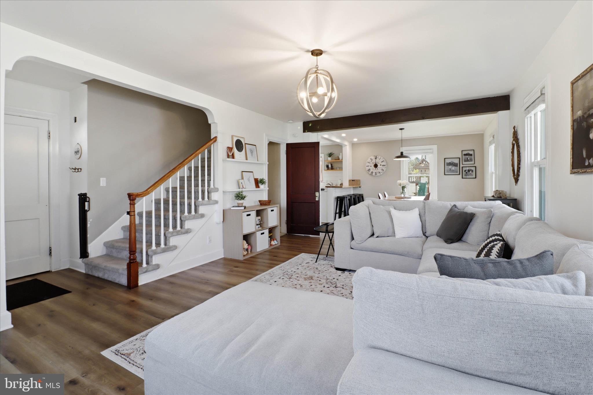327 Dover Street Manheim, PA 17545 - Photo 8 of 43 a living room with furniture a wooden floor and a chandelier