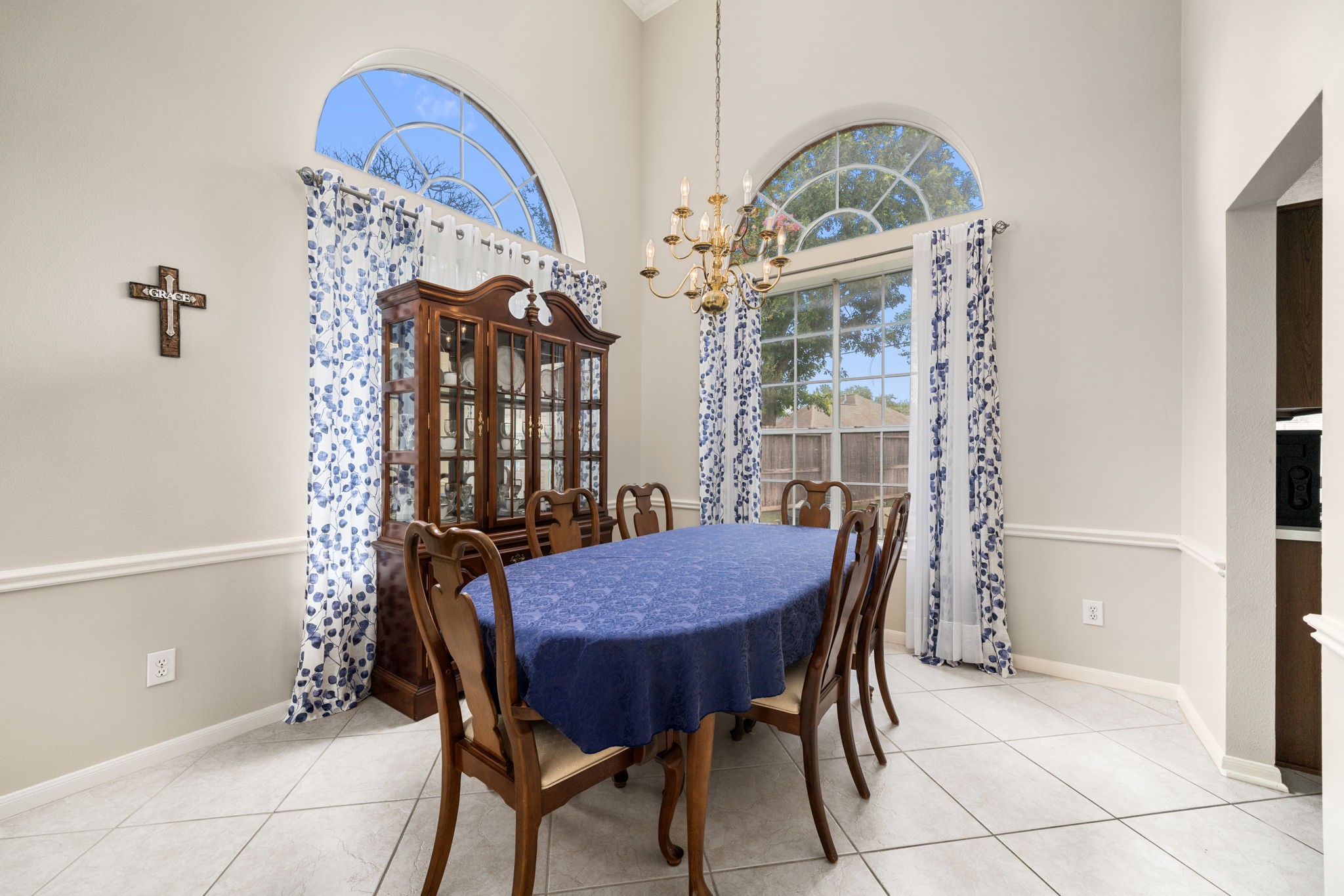 9715 Therrell Drive Houston, TX 77064 - Photo 10 of 33 This dining room features high ceilings and large arched windows for ample natural light.