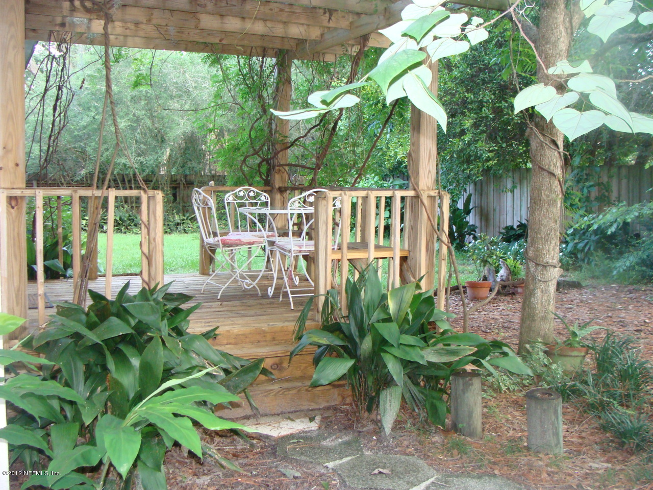 5428 Stetson Road Jacksonville, FL 32207 - Photo 1 of 27 a garden view with a seating space