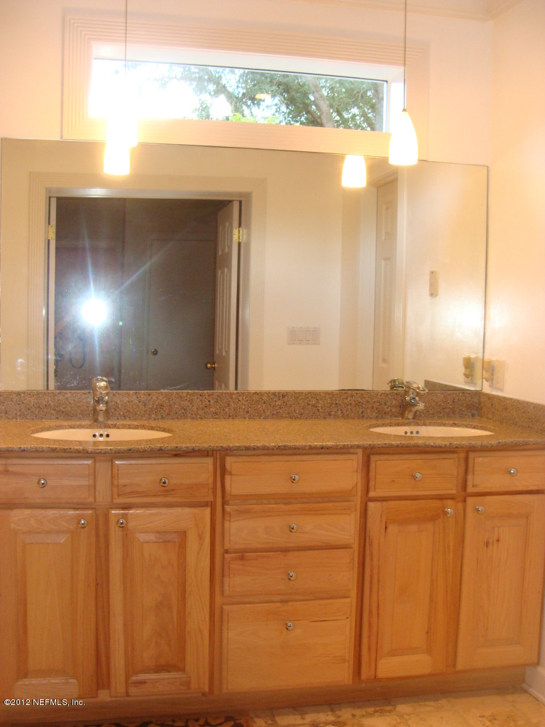 5428 Stetson Road Jacksonville, FL 32207 - Photo 17 of 27 a bathroom with a sink and a mirror