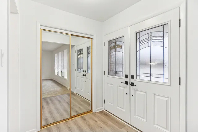 a living room with furniture a rug and a flat screen tv