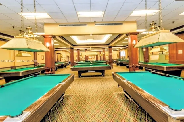 a front view of a house with swimming pool having outdoor seating