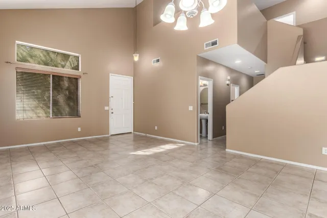 a view of an entryway with a chandelier