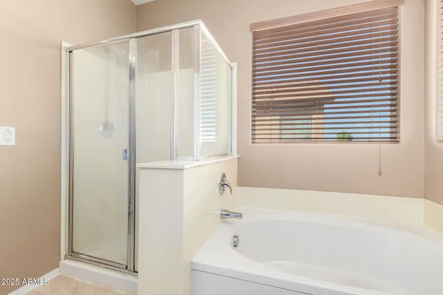 a white bath tub sitting next to a window