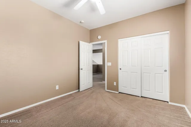 an empty room with closet area