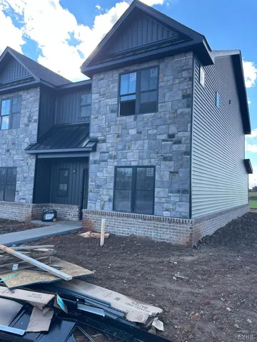 a front view of a house with yard