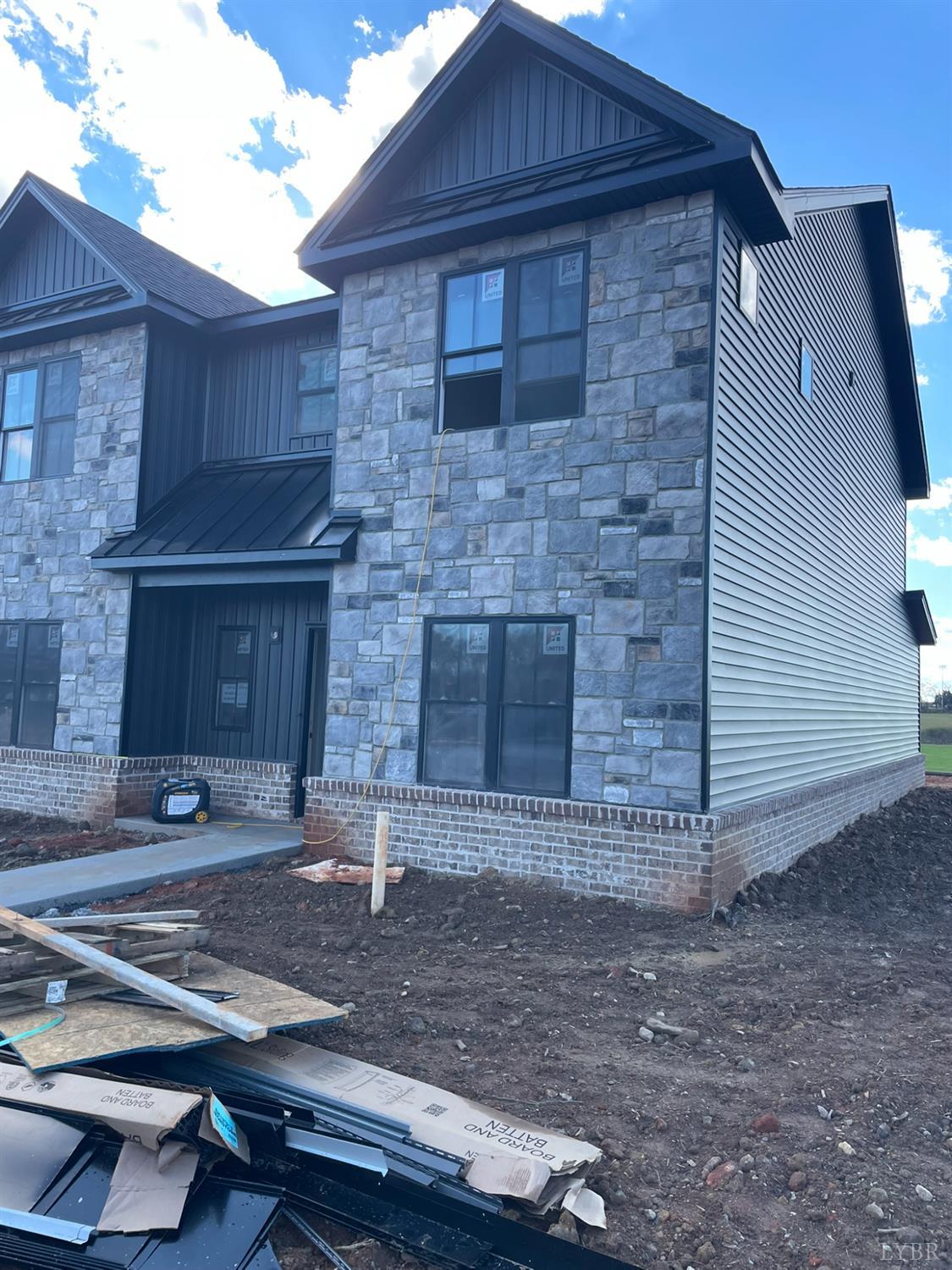 18 Faith Court Rustburg, VA 24588 - Photo 2 of 8 a front view of a house with yard