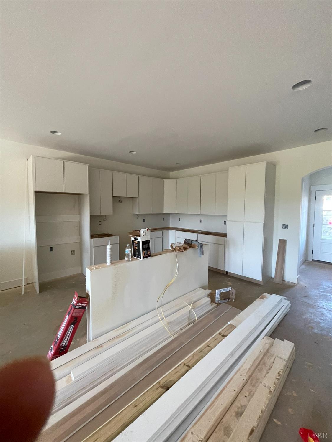 18 Faith Court Rustburg, VA 24588 - Photo 6 of 8 a living room with stainless steel appliances furniture a rug and a kitchen view