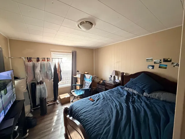 a bed room with a bed and a walk in closet