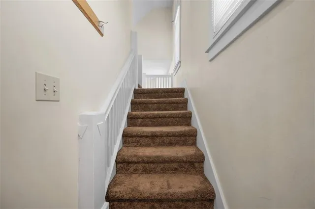 a bathroom with a sink a vanity and shower